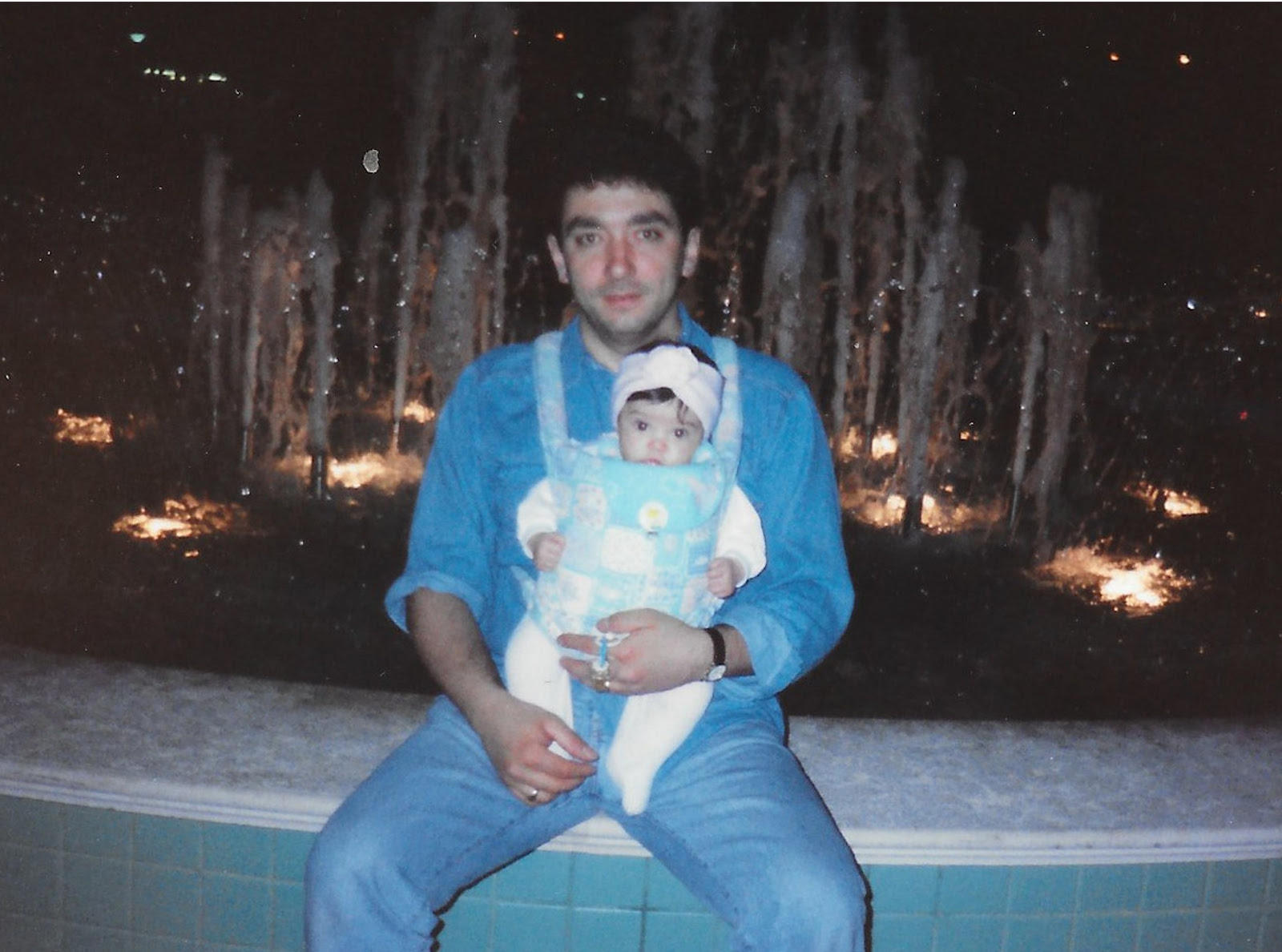 Photo of my father and I when I was 1 years old in Cattolica (italy) sit on the border of a fountain